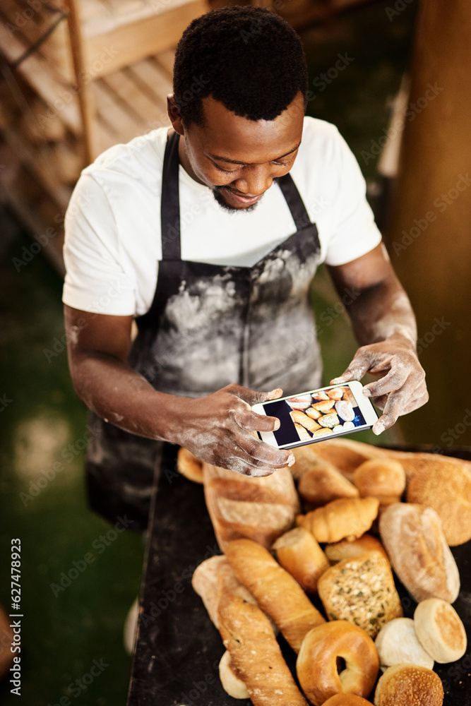 This picture is for todays online baking tips. Cropped shot of a male baker taking a picture on his 