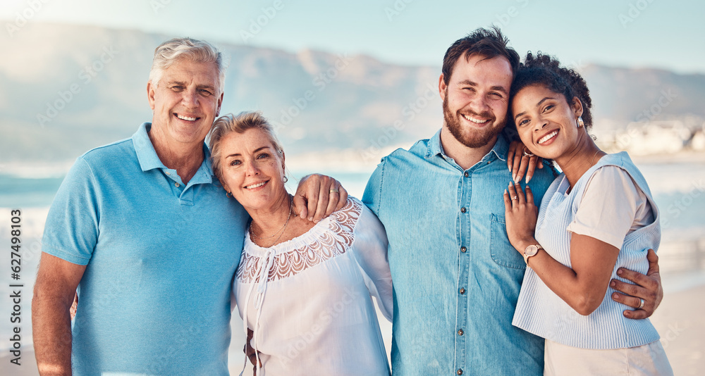 Portrait, diversity and love with a blended family on the beach together in summer for vacation or h