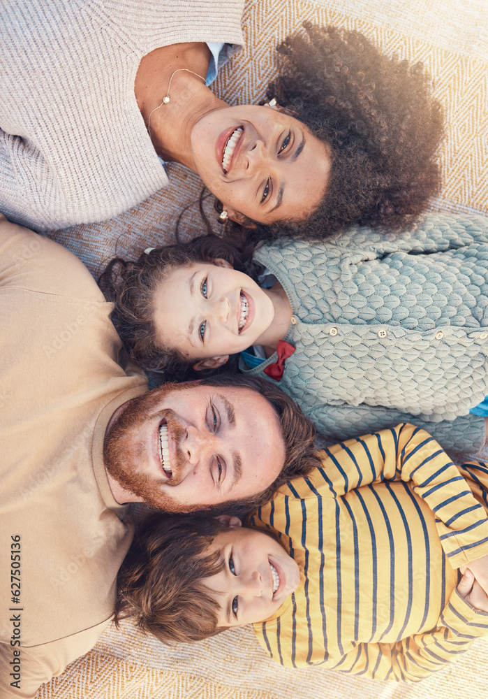 Portrait, happy family and top view on carpet in home for bonding together. Face, smile and parents 