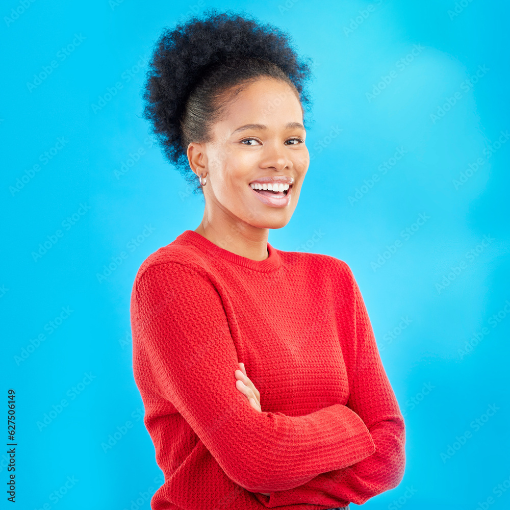 Happy, smile and portrait of a woman with style and confident isolated in a studio blue background. 