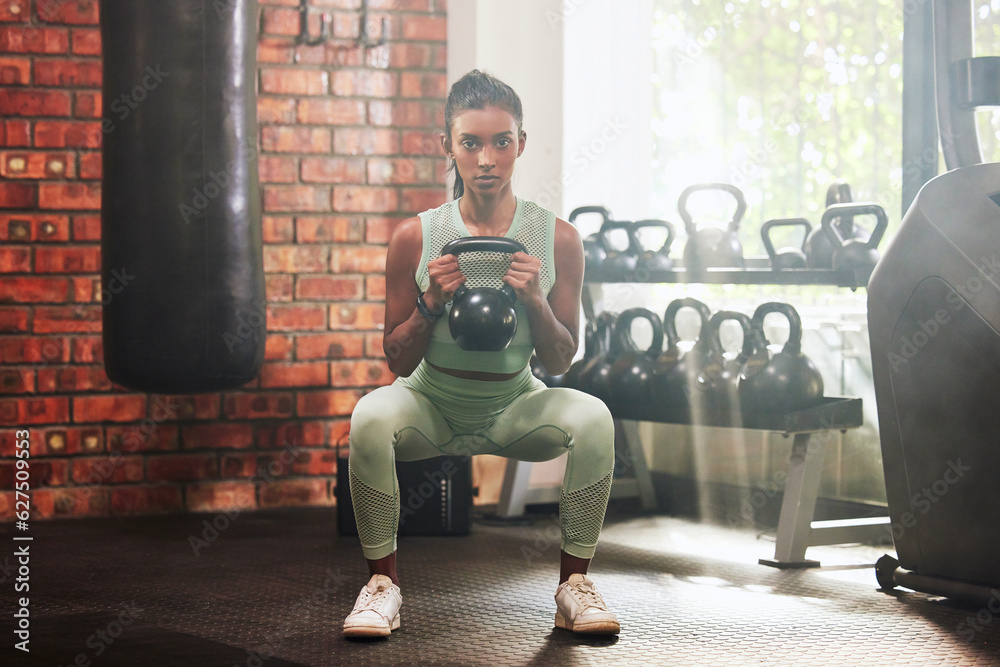 Fitness, kettlebell and portrait of a woman in the gym doing strength legs and arms training. Sports