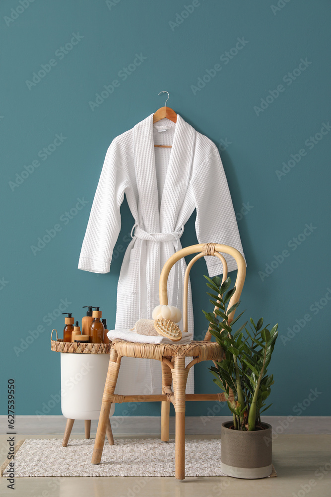 Interior of bathroom with stool, table and accessories