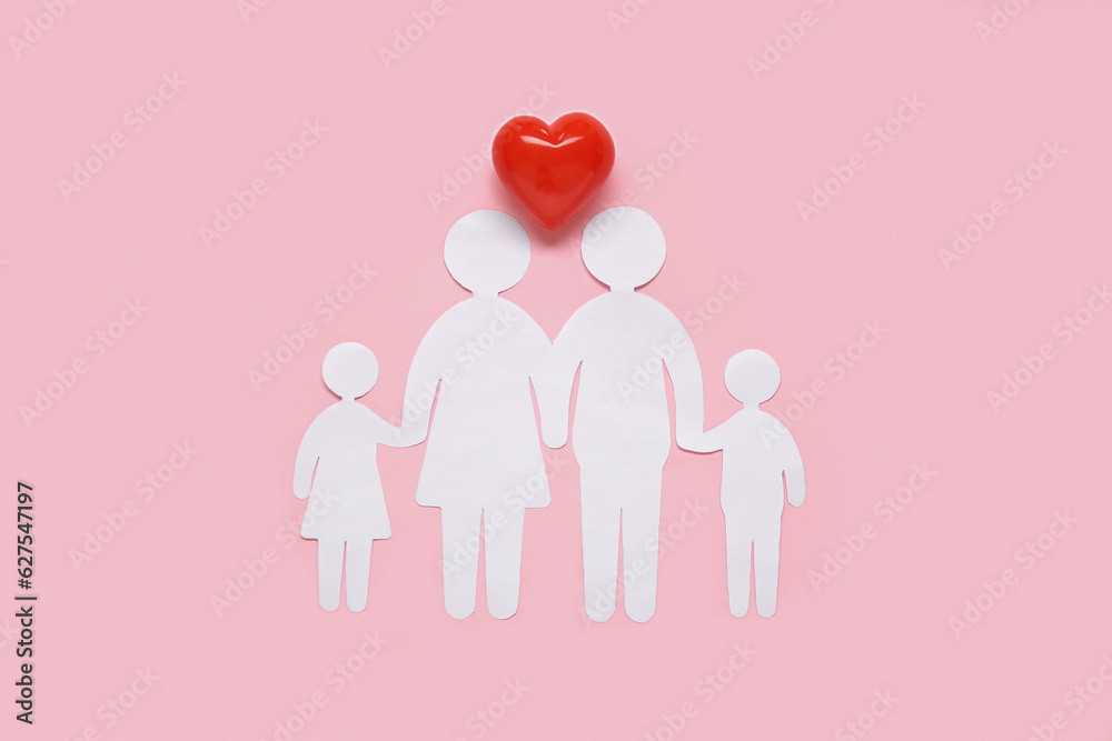 Figures of family and heart on pink background. Health insurance concept