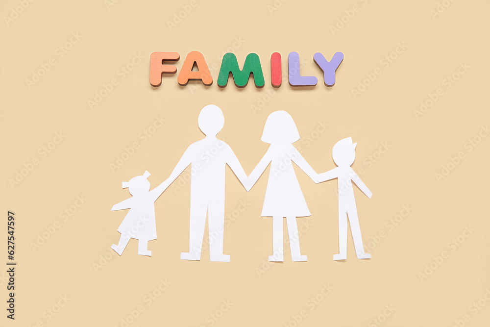 Human figures and word FAMILY made of wooden letters on beige background