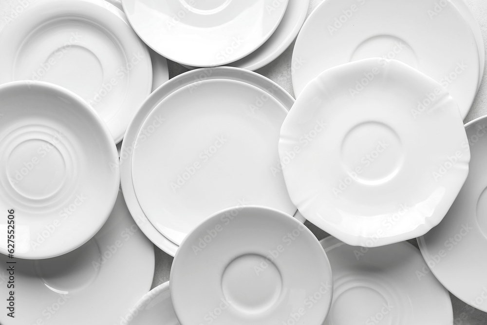 Many clean white plates as background