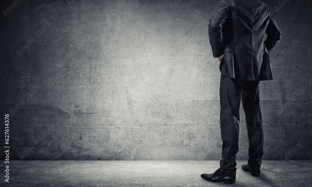 Businessman looking at wall