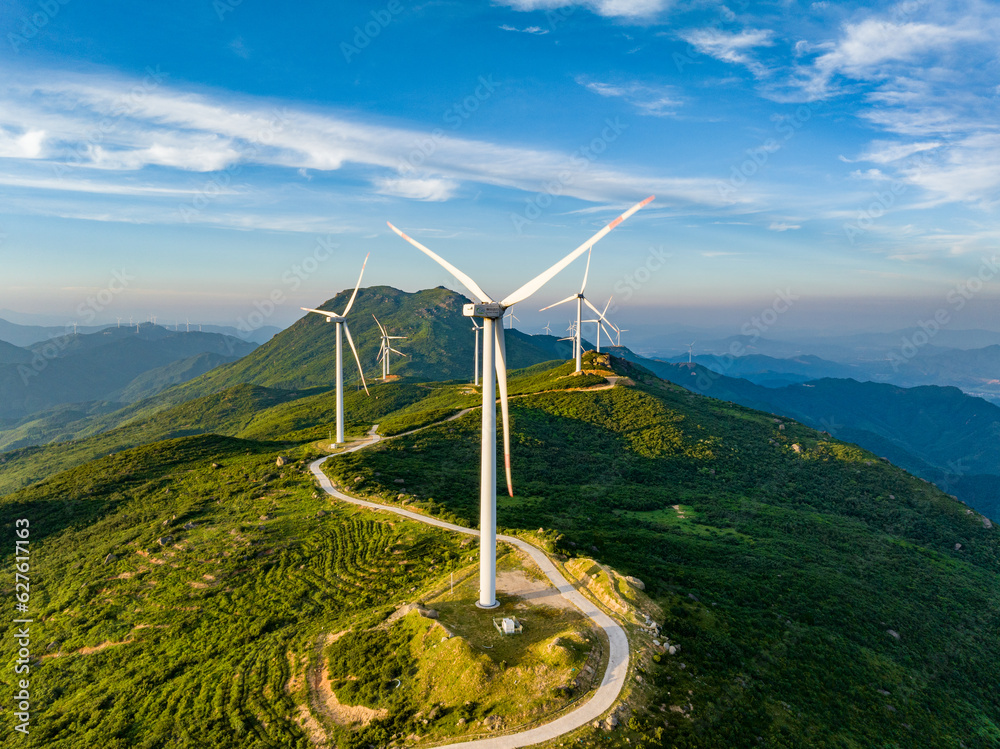 Wind farm on the mountain, blue sky and white clouds