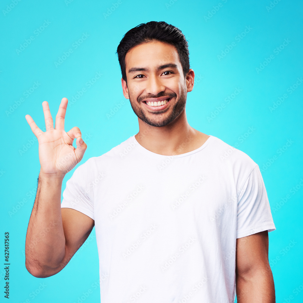 Happy, perfect gesture and portrait of a man in a studio with an agreement sign or expression. Happi