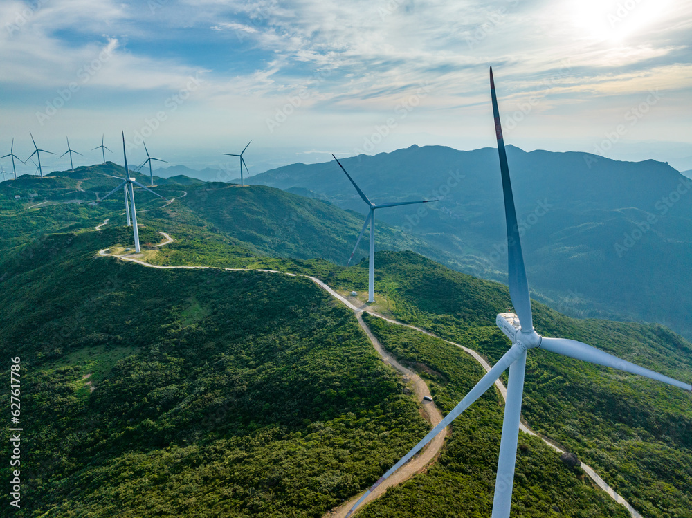 Wind farm on the mountain, blue sky and white clouds