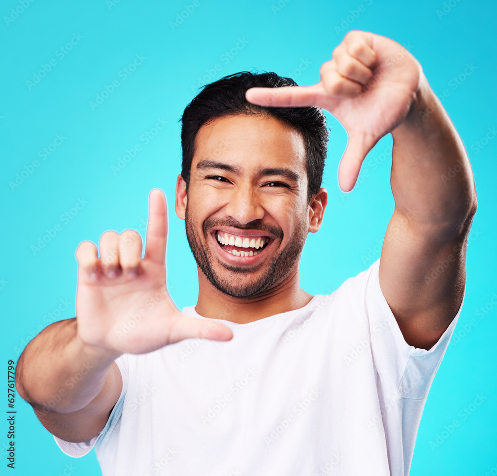 Happy, hand frame and portrait of a man for a selfie, creative aesthetic or advertising photography.