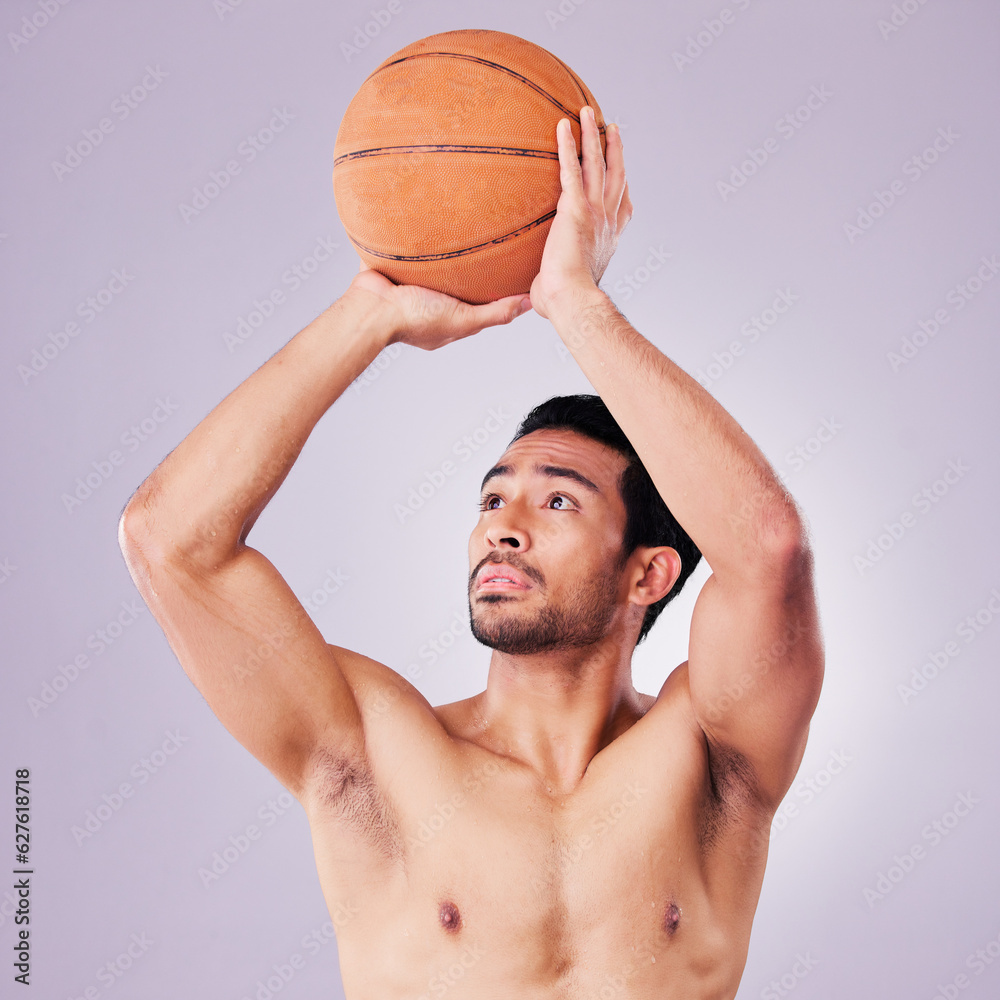 Fitness, basketball and a sports asian man shooting in studio on a gray background for training or a