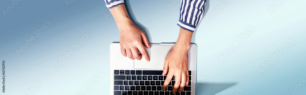 Person using a laptop computer from above