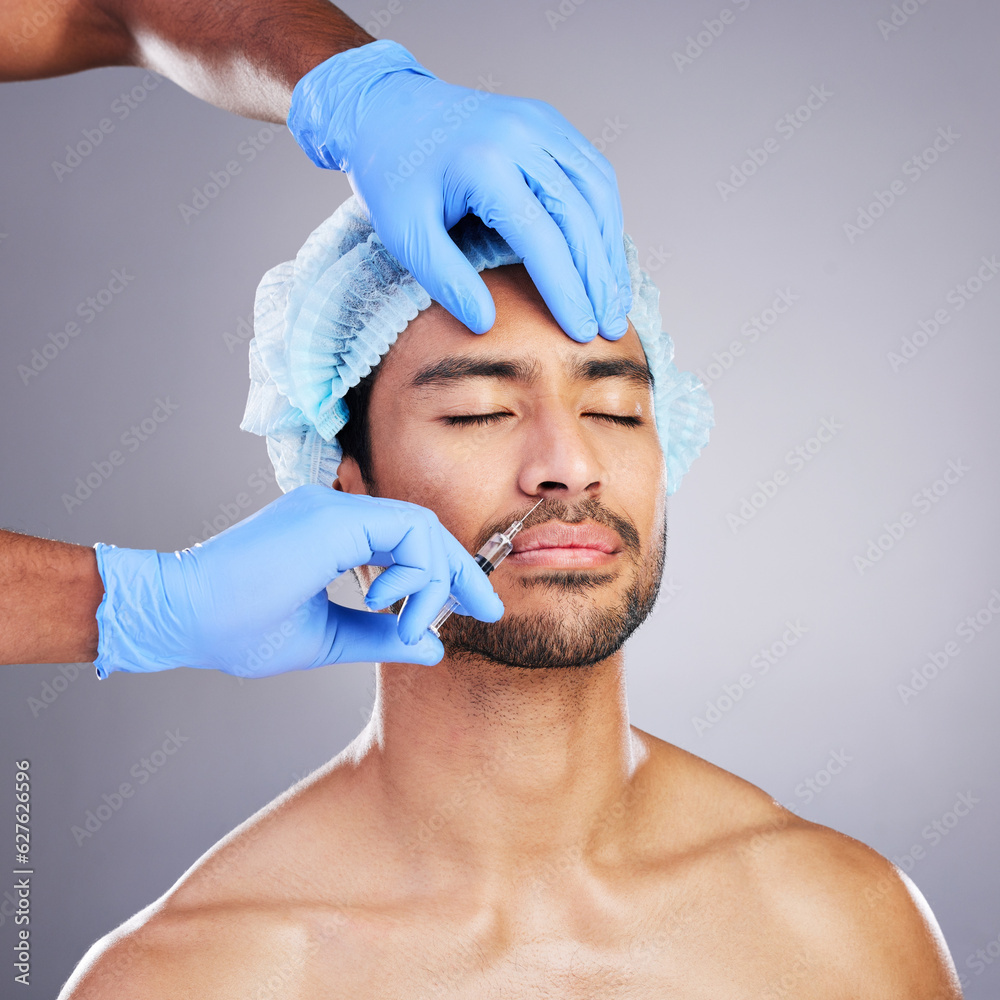 Hands, face and change with a man in studio on a gray background for a silicon injection. Beauty, pl