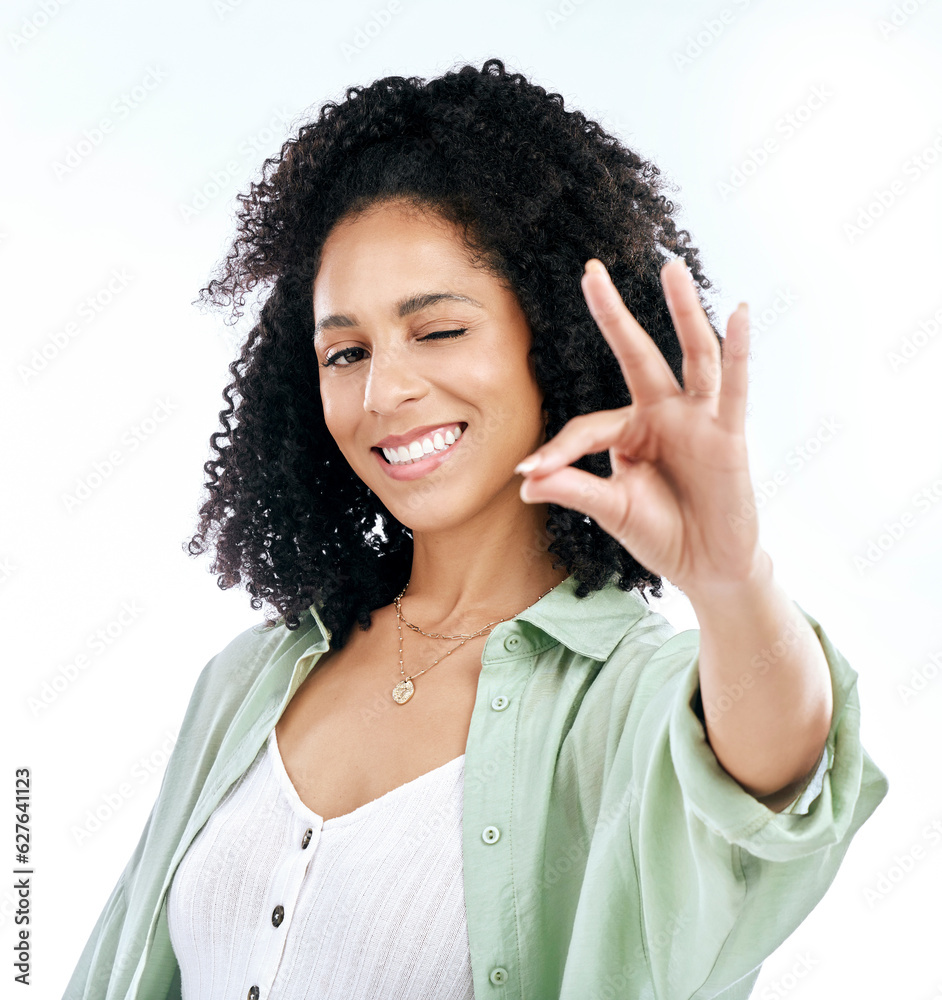 Wink, studio and woman portrait with perfect hand sign for support or agree, vote or review on white