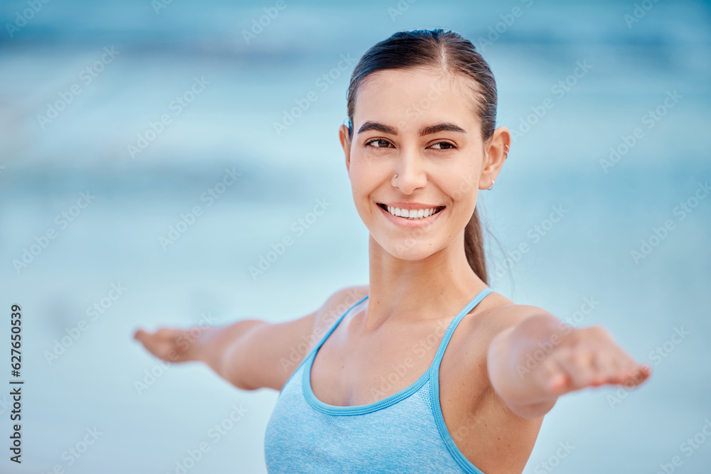 Fitness, yoga and face of woman by beach with warrior pose for wellness, healthy body and energy. Sp