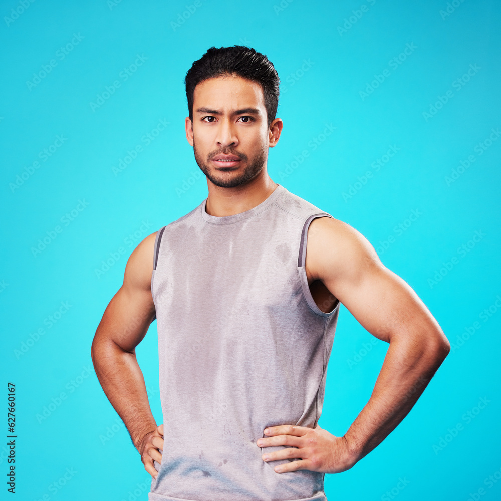 Portrait, fitness and confident Asian man sweat in studio isolated on a blue background. Face, serio