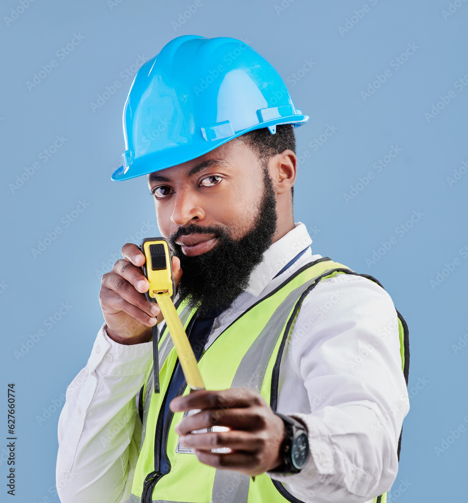 Black man, portrait and architect with measuring tape for construction against a blue studio backgro