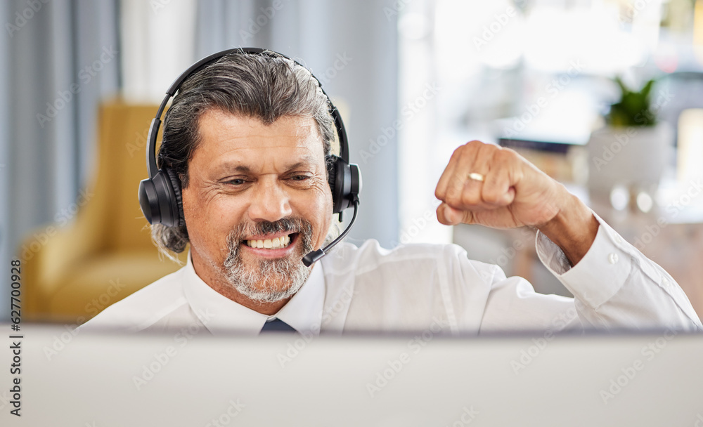 Call centre, happy and a man at computer to celebrate success, achievement or bonus win. A mature ma