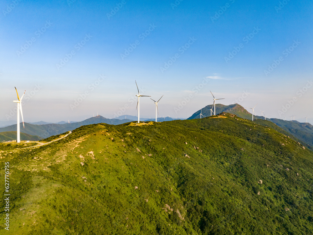 Wind farm on the mountain, blue sky and white clouds