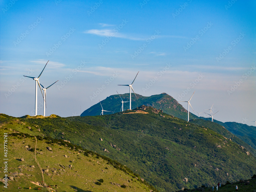 Wind farm on the mountain, blue sky and white clouds