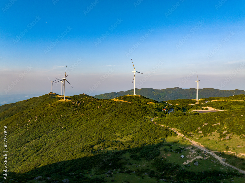 Wind farm on the mountain, blue sky and white clouds