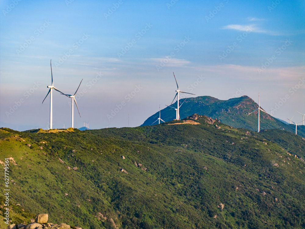 Wind farm on the mountain, blue sky and white clouds