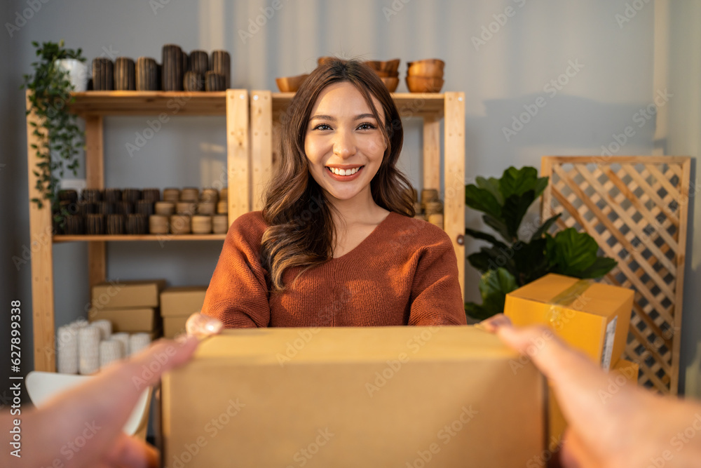 Portrait of young woman receive box form deliverly man in store house. 