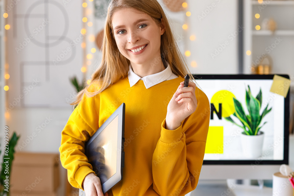 Female graphic designer with tablet in office