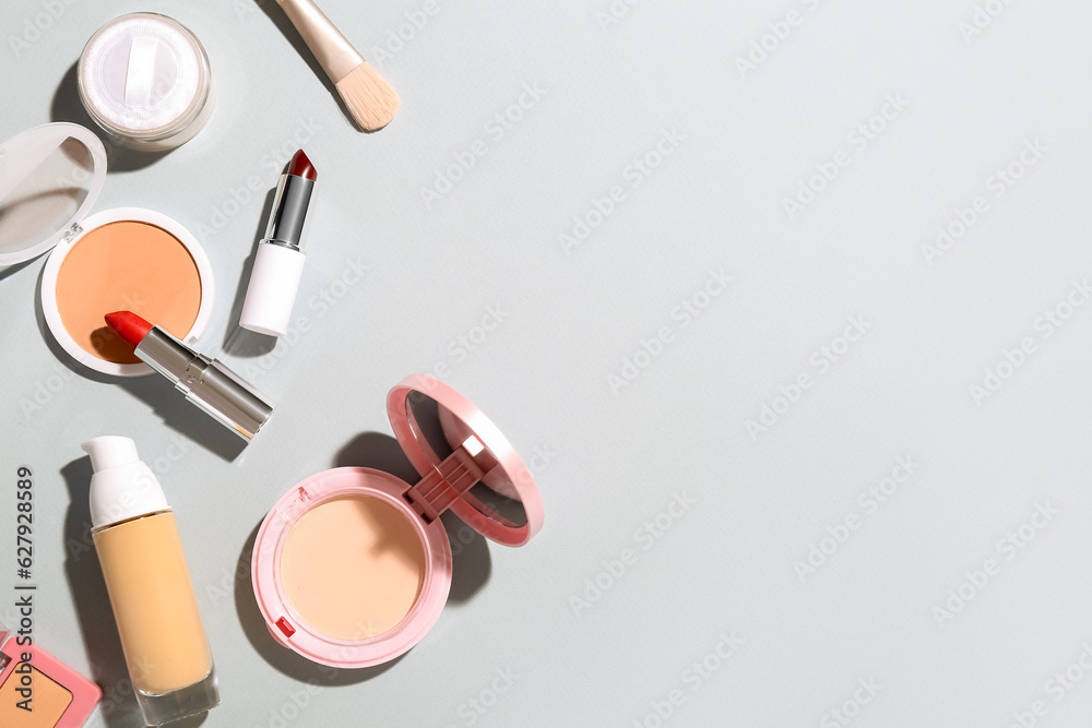 Decorative cosmetics on grey background