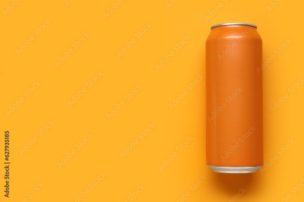 Can of soda on orange background