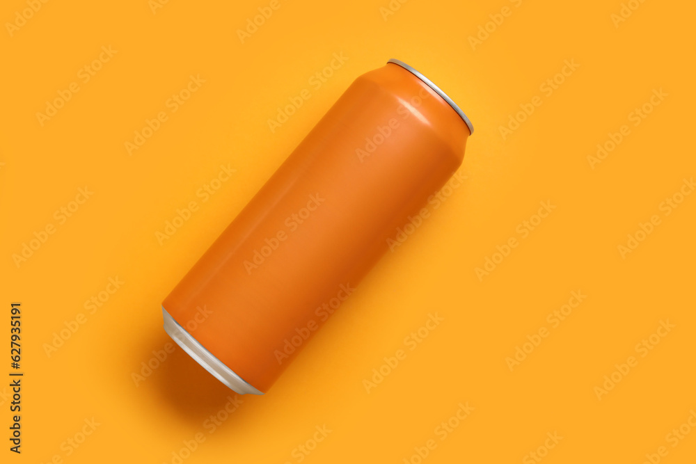 Can of soda on orange background