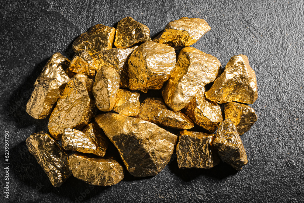 Golden nuggets on dark background