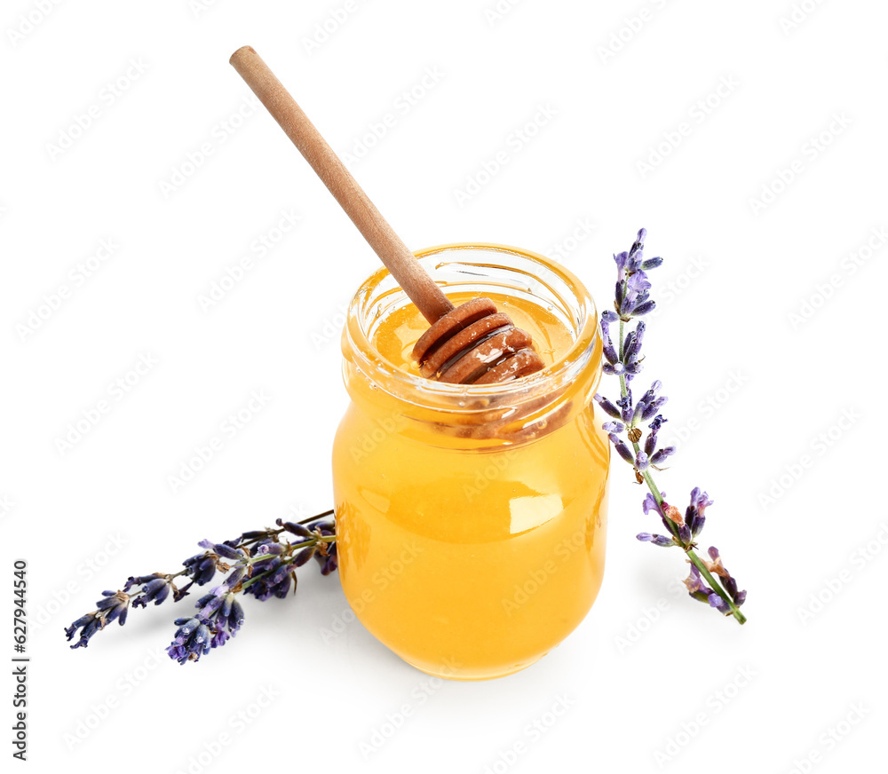 Jar of sweet lavender honey, dipper and flowers on white background