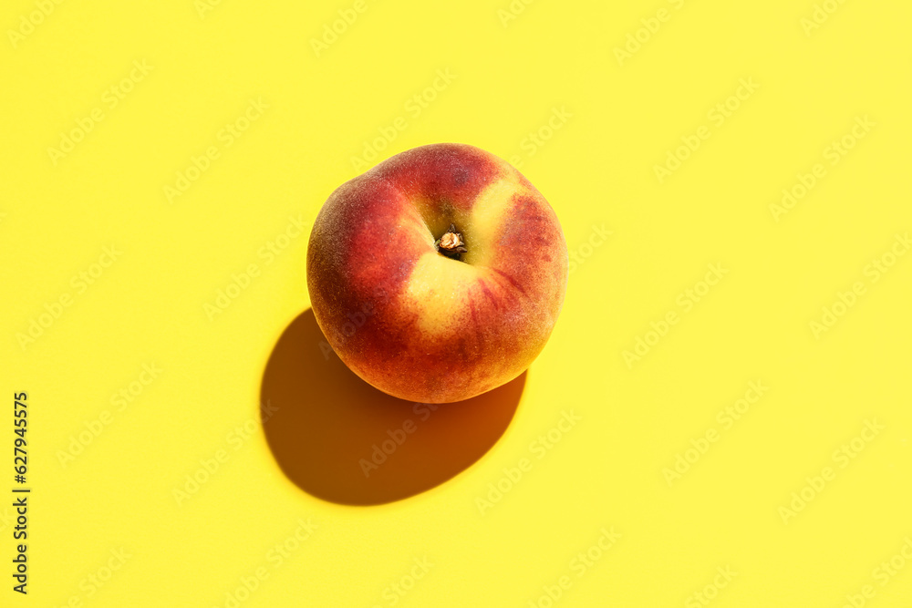 Sweet peach on yellow background