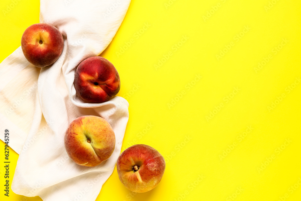 Sweet peaches on yellow background