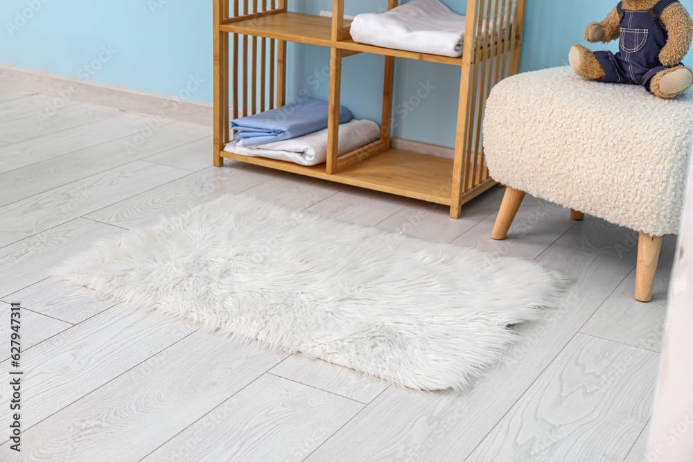 White fur rug in interior of childrens room, closeup