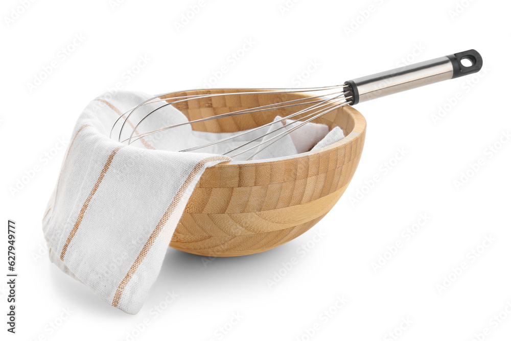 Wooden bowl, napkin and whisk on white background