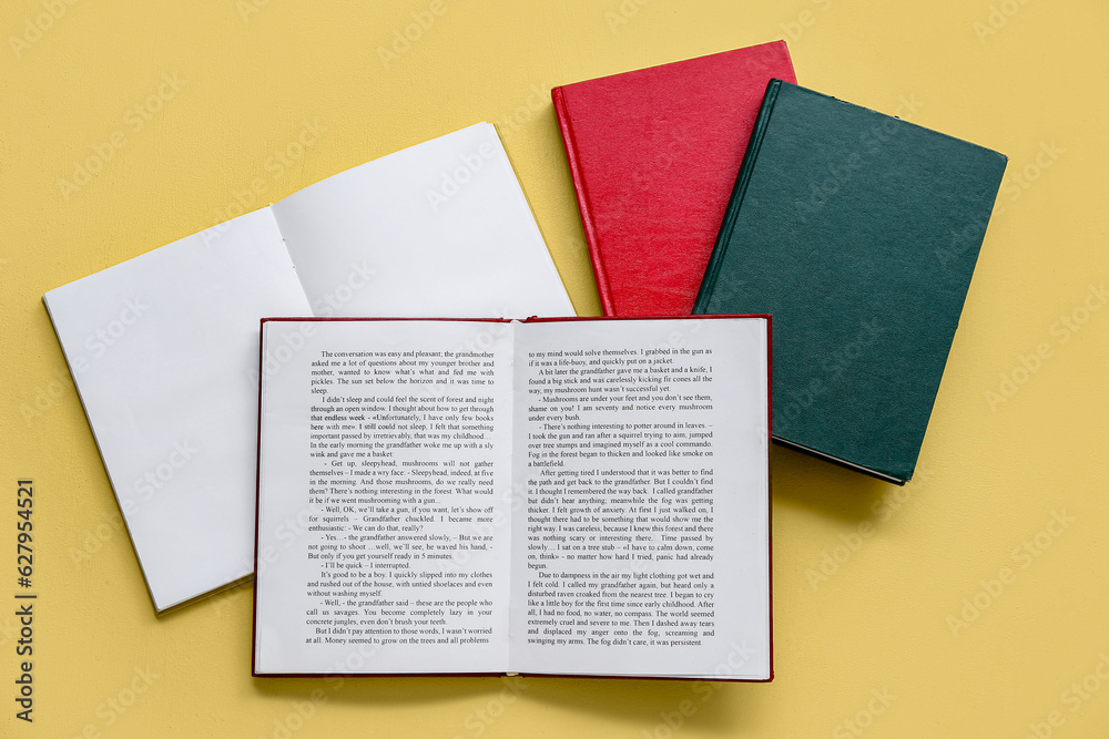 Open books on yellow background