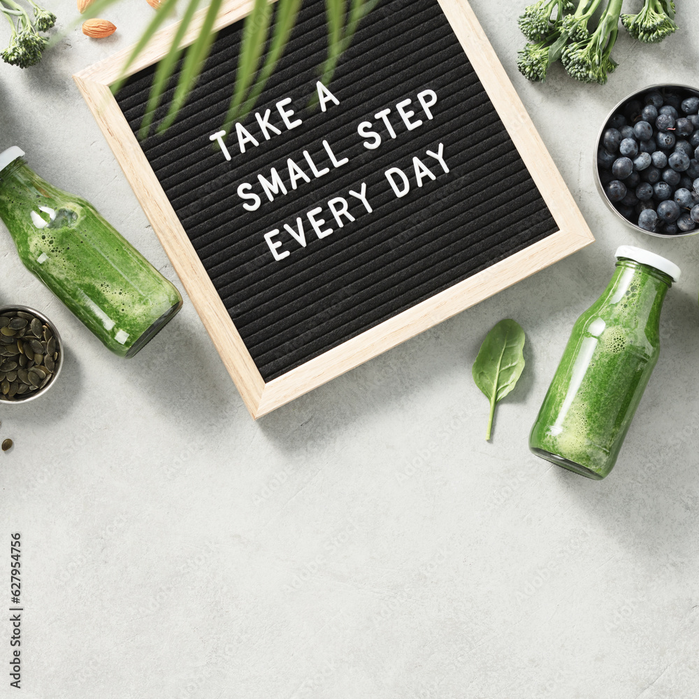 Take a small step every day letter board quote flat lay