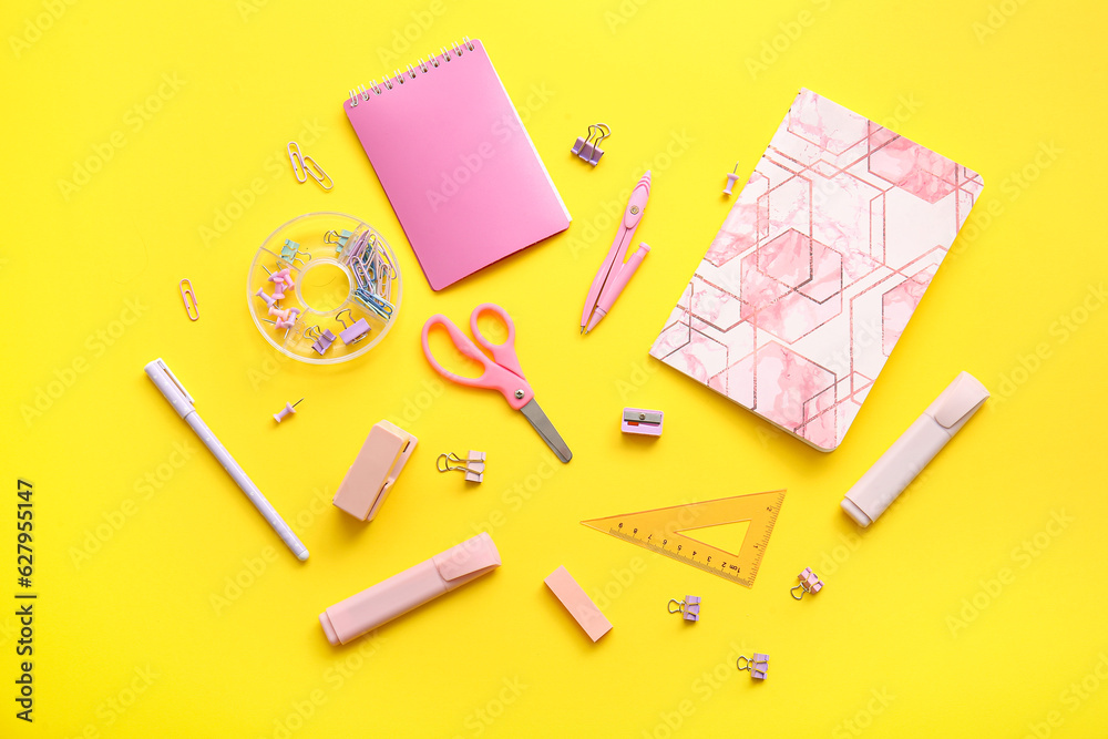 Different school stationery and notebooks on yellow background