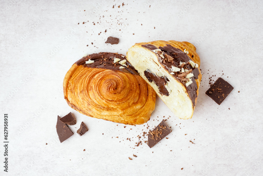 Sweet croissant with chocolate on white background