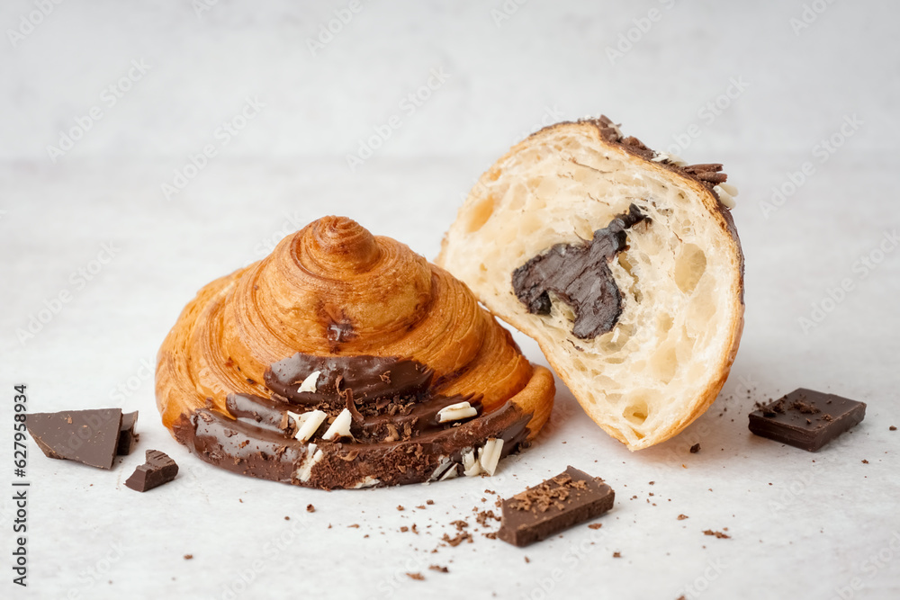 Sweet croissant with chocolate on white background