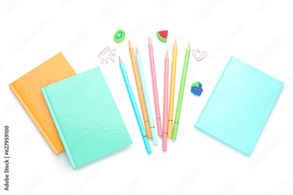 Notebooks and school stationery on white background