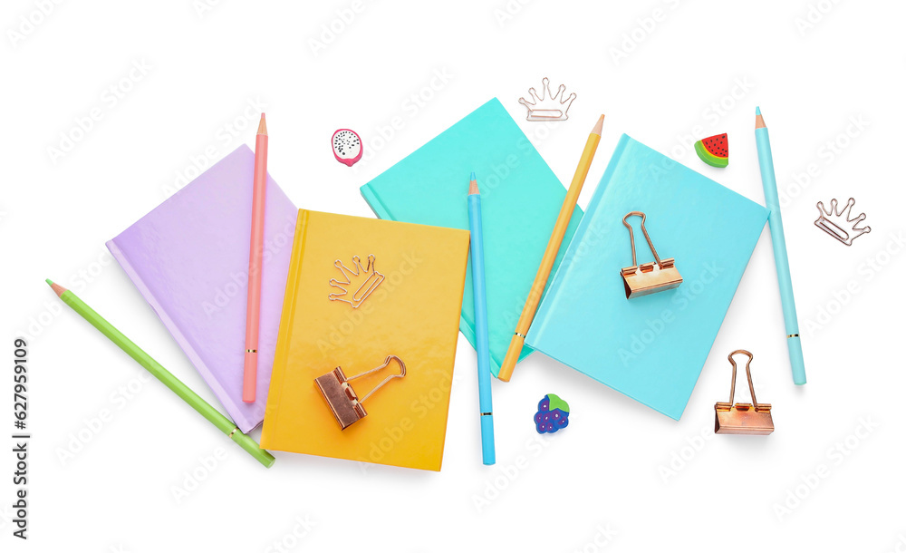 Notebooks and school stationery on white background