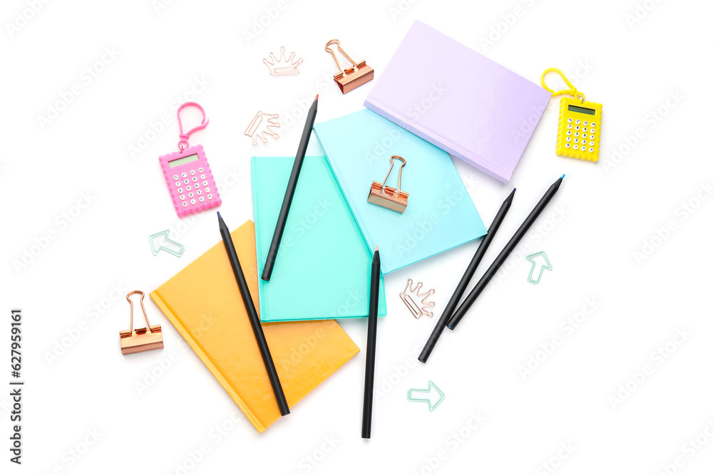 Notebooks and school stationery on white background