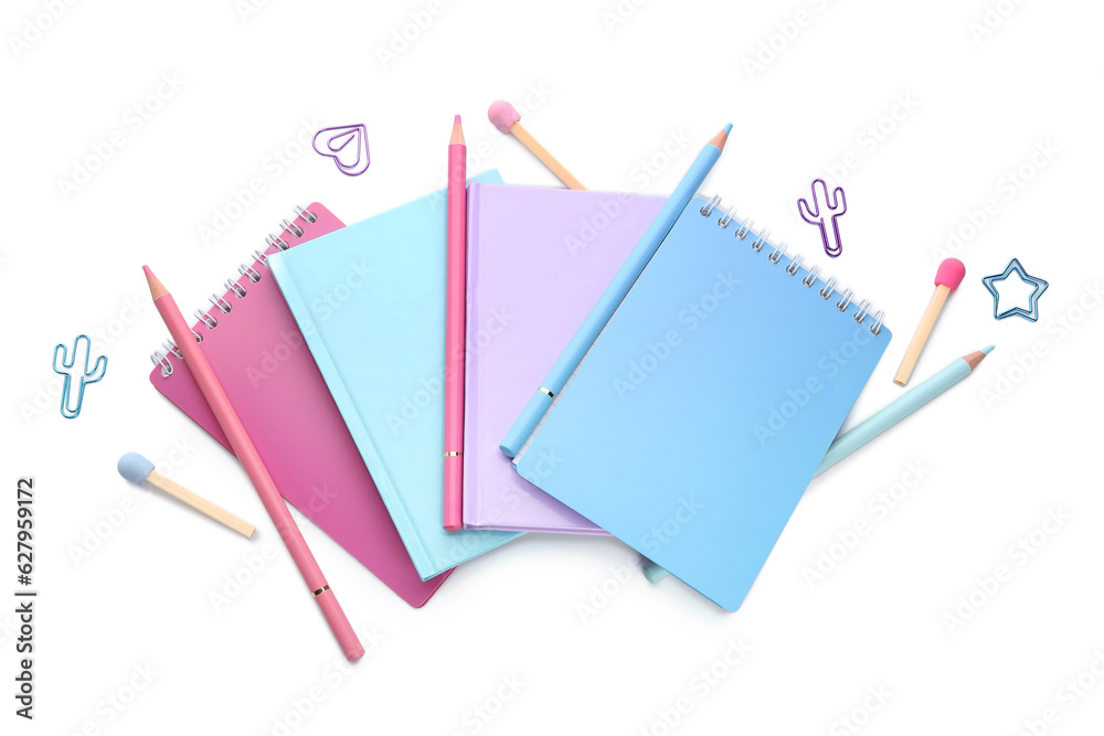 Notebooks and school stationery on white background