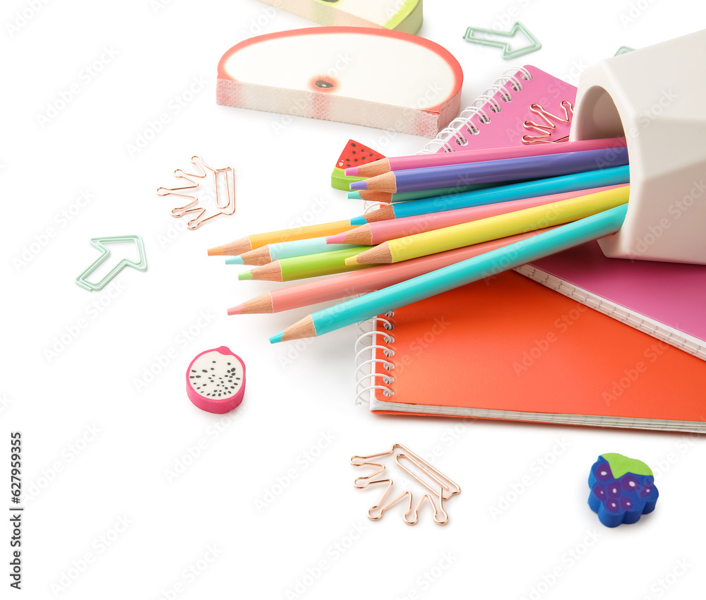 Cup with school stationery and notebooks on white background