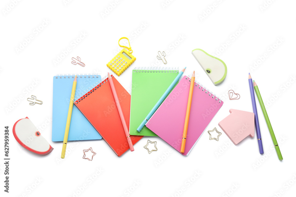 Notebooks and school stationery on white background