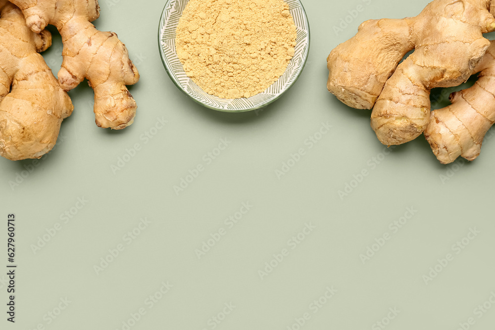 Fresh ginger roots and bowl with dried powder on grey background