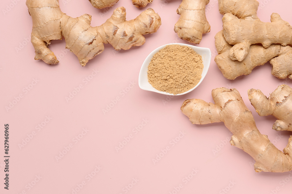 Fresh ginger roots and bowl with dried powder on pink background